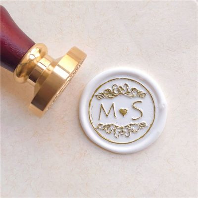 Sealing wax personalized with initials and ornament